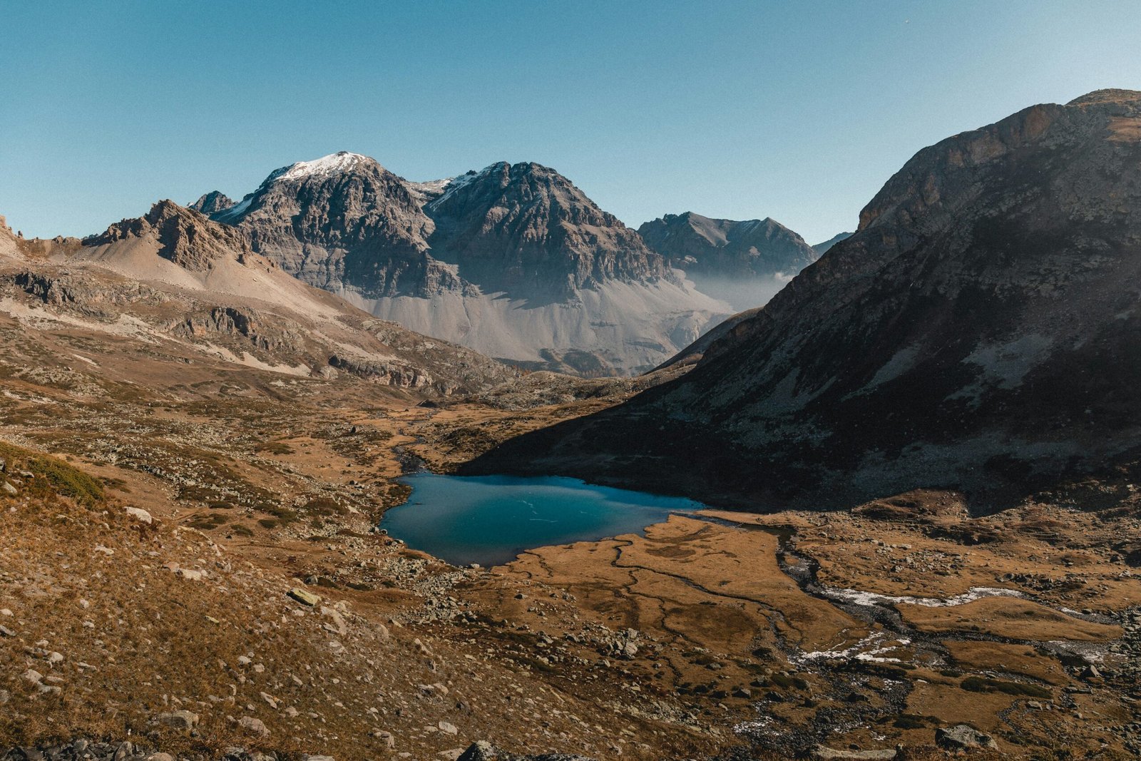 a mountain range with a lake in the middle